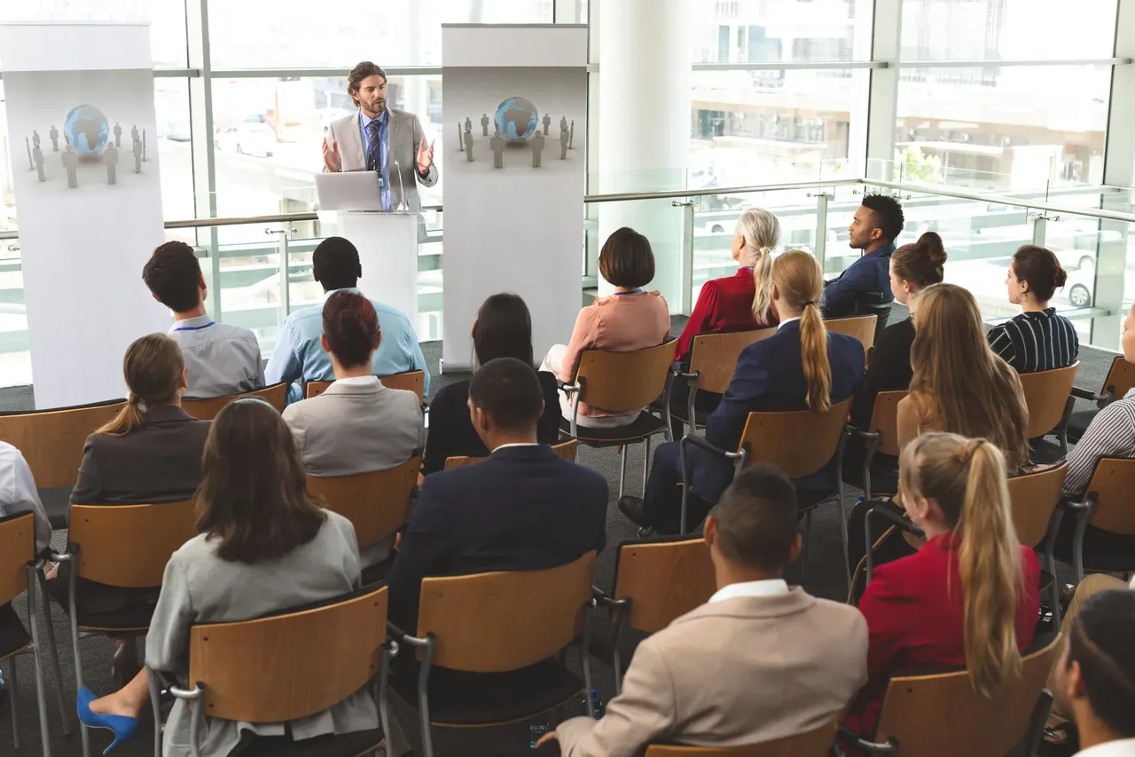 Privacy specialist delivering a security awareness seminar to a small group