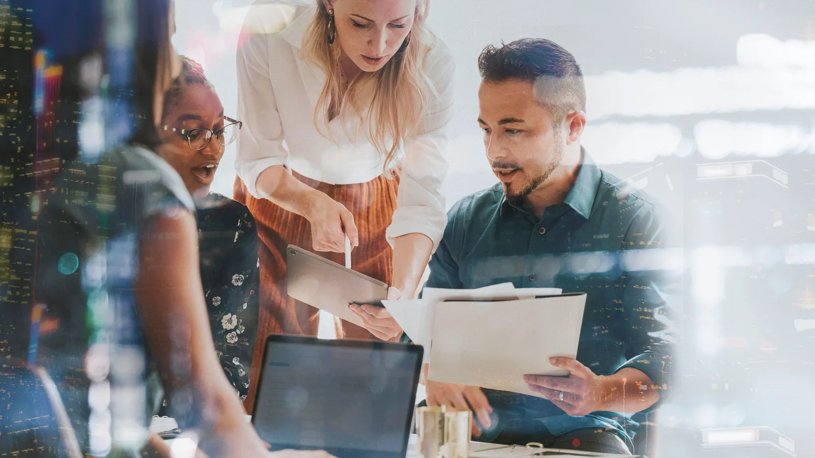 A small-business team in a technology planning meeting