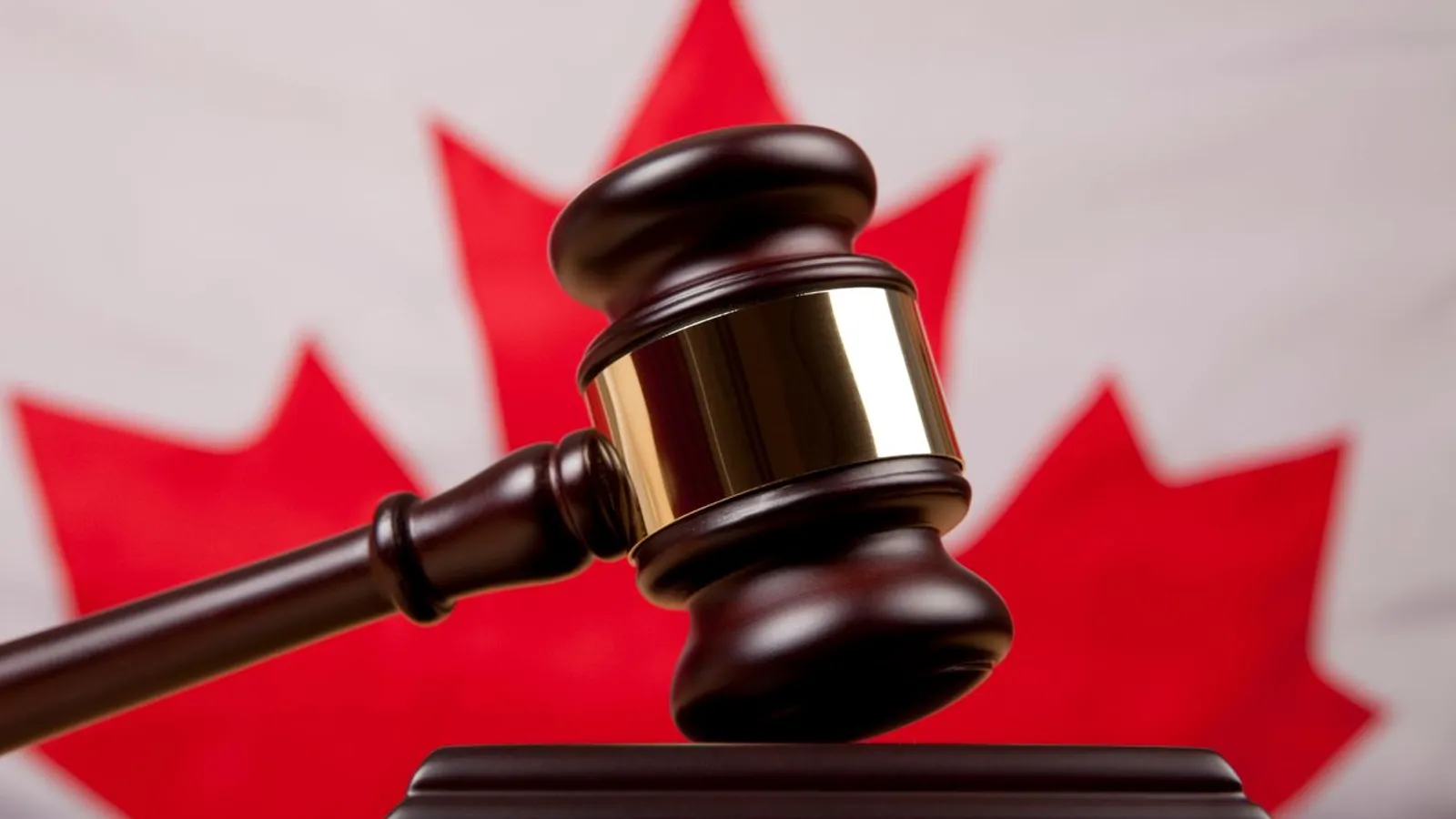 gavel in front of canadian flag