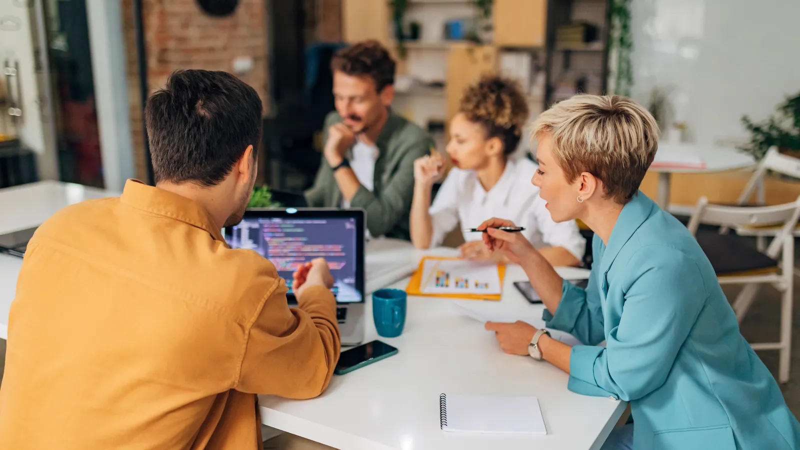 A cybersecurity team planning around a conference table