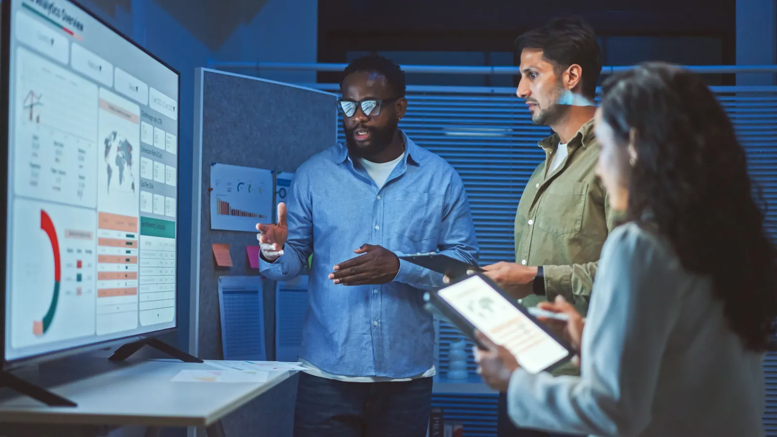 Startup team reviewing compliance documents in a modern office
