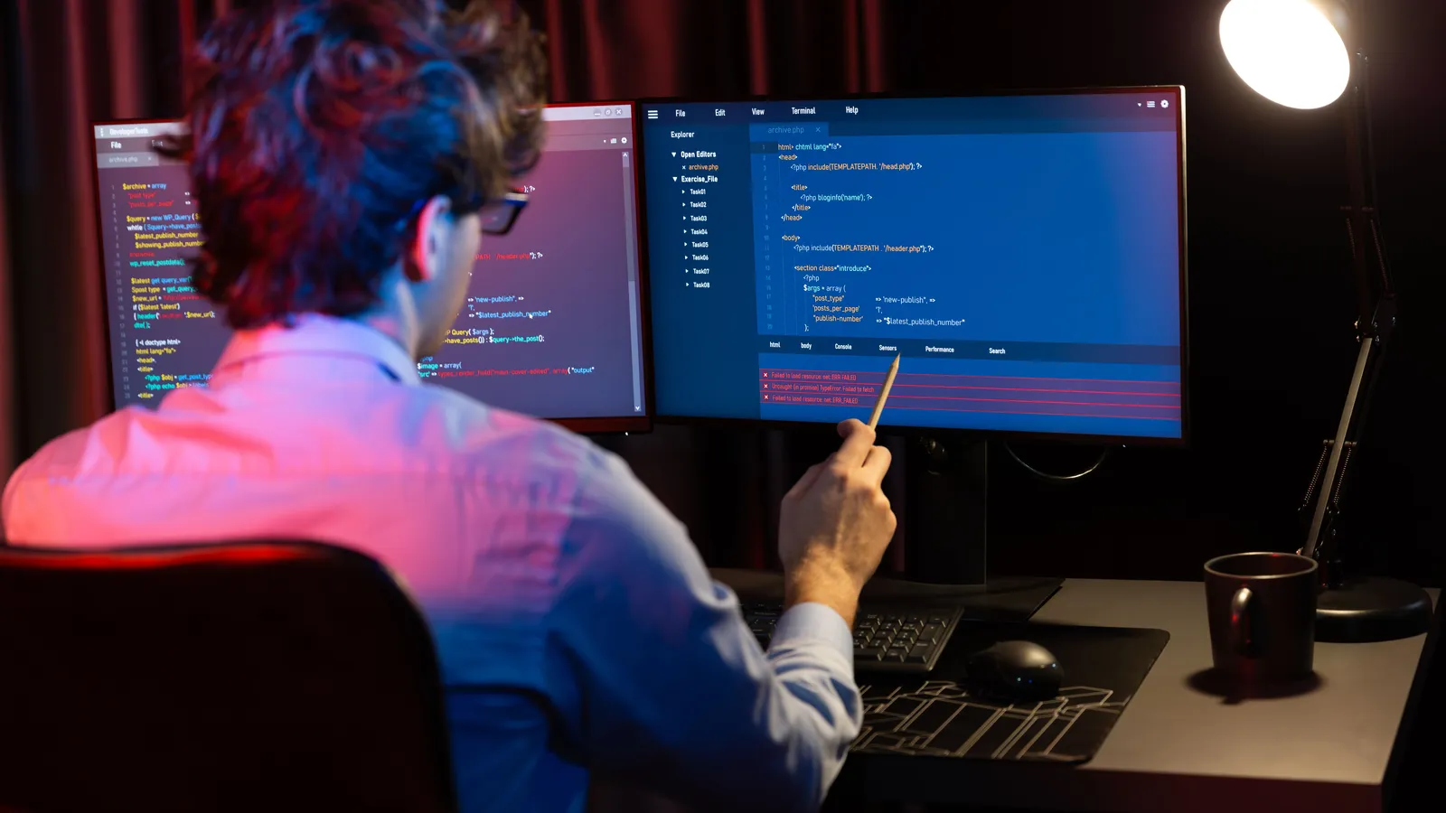 A penetration tester reviewing code on screen