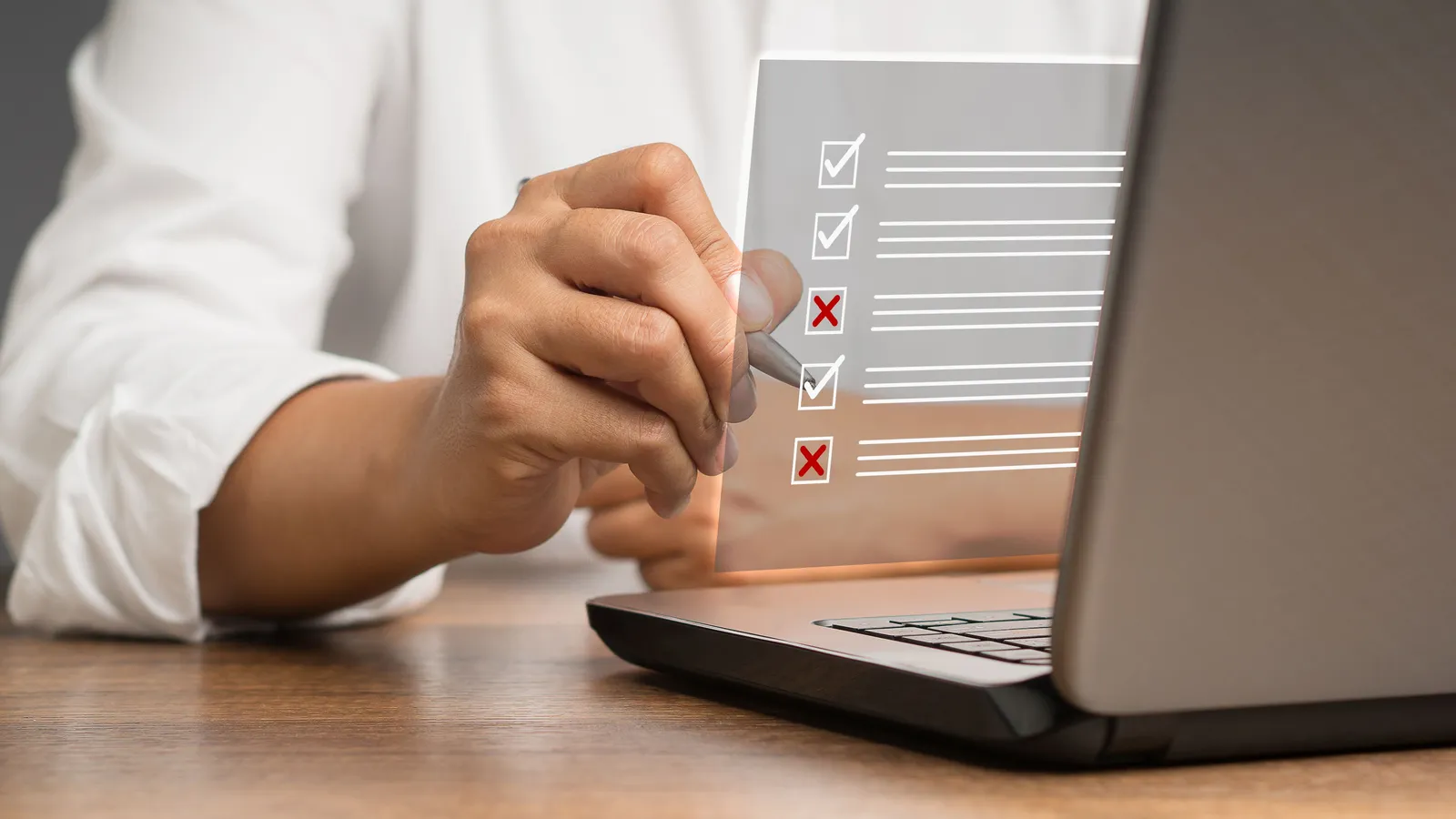 A cybersecurity audit checklist open on a laptop