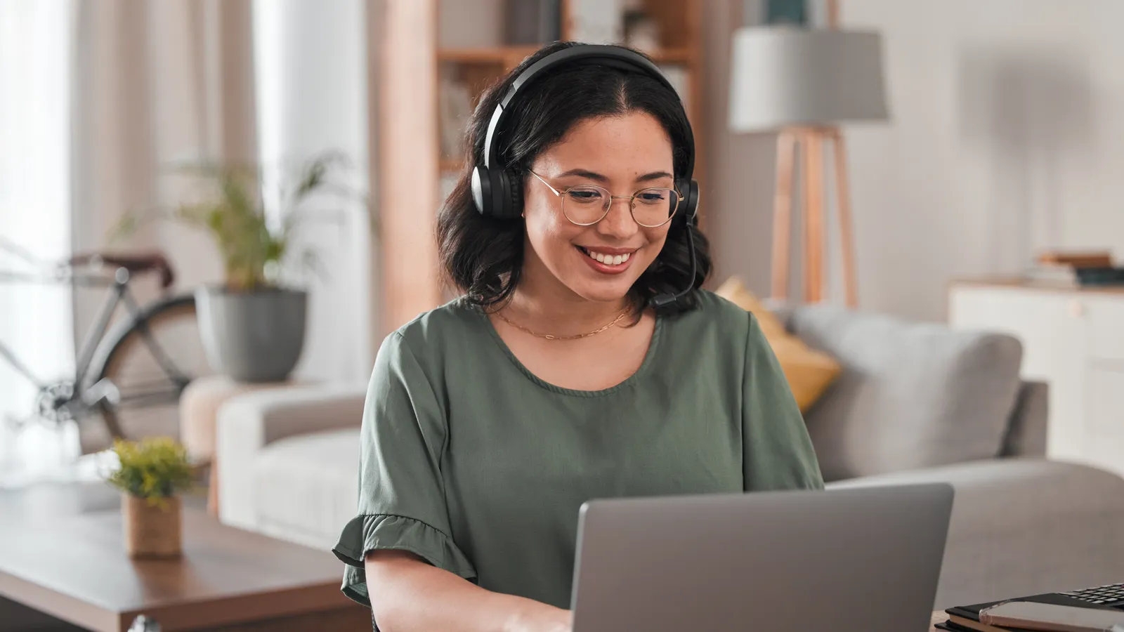 An employee using an AI assistant on a laptop