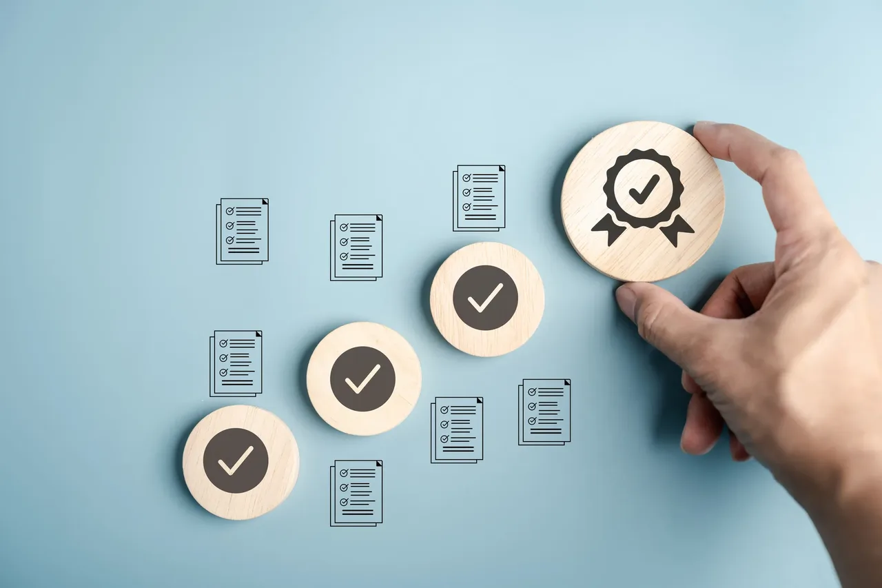 A professional placing a certification approval badge