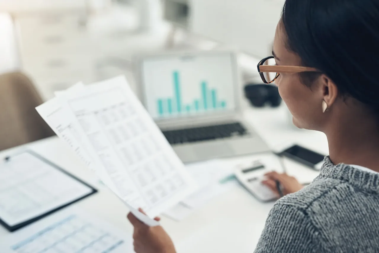 A businesswoman reviewing privacy compliance documents