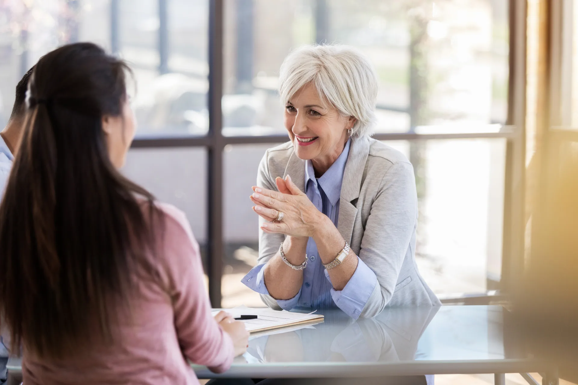 Cheerful counselor works with married couple