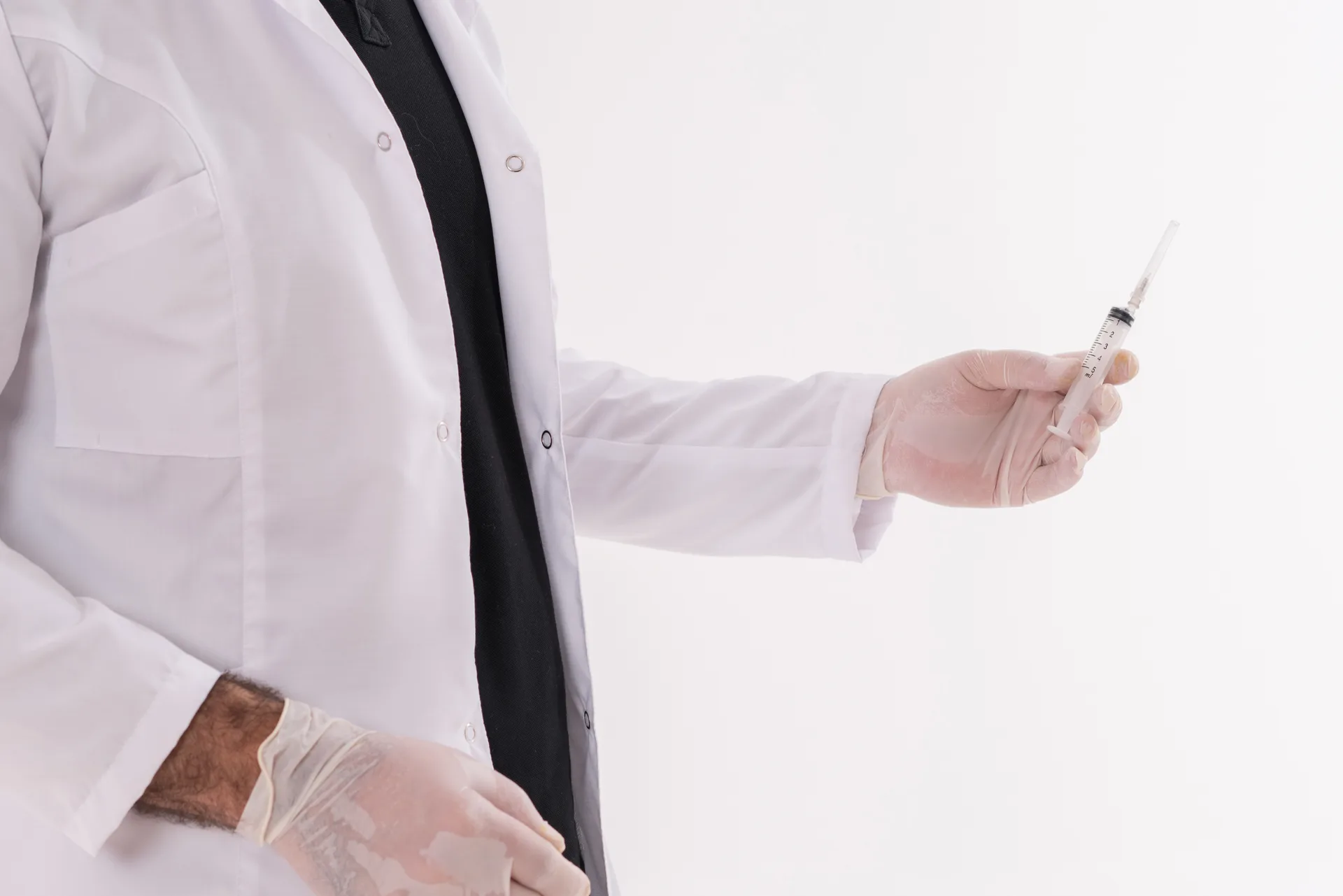 Male Doctor Holding Syringe with Injection