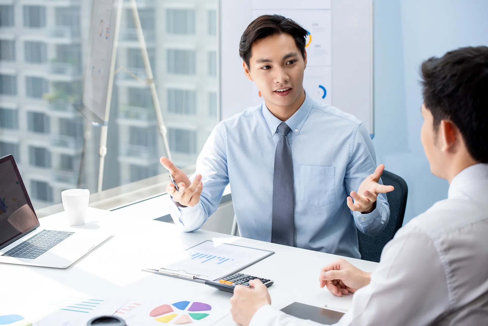 Financial broker explaning business data to his client