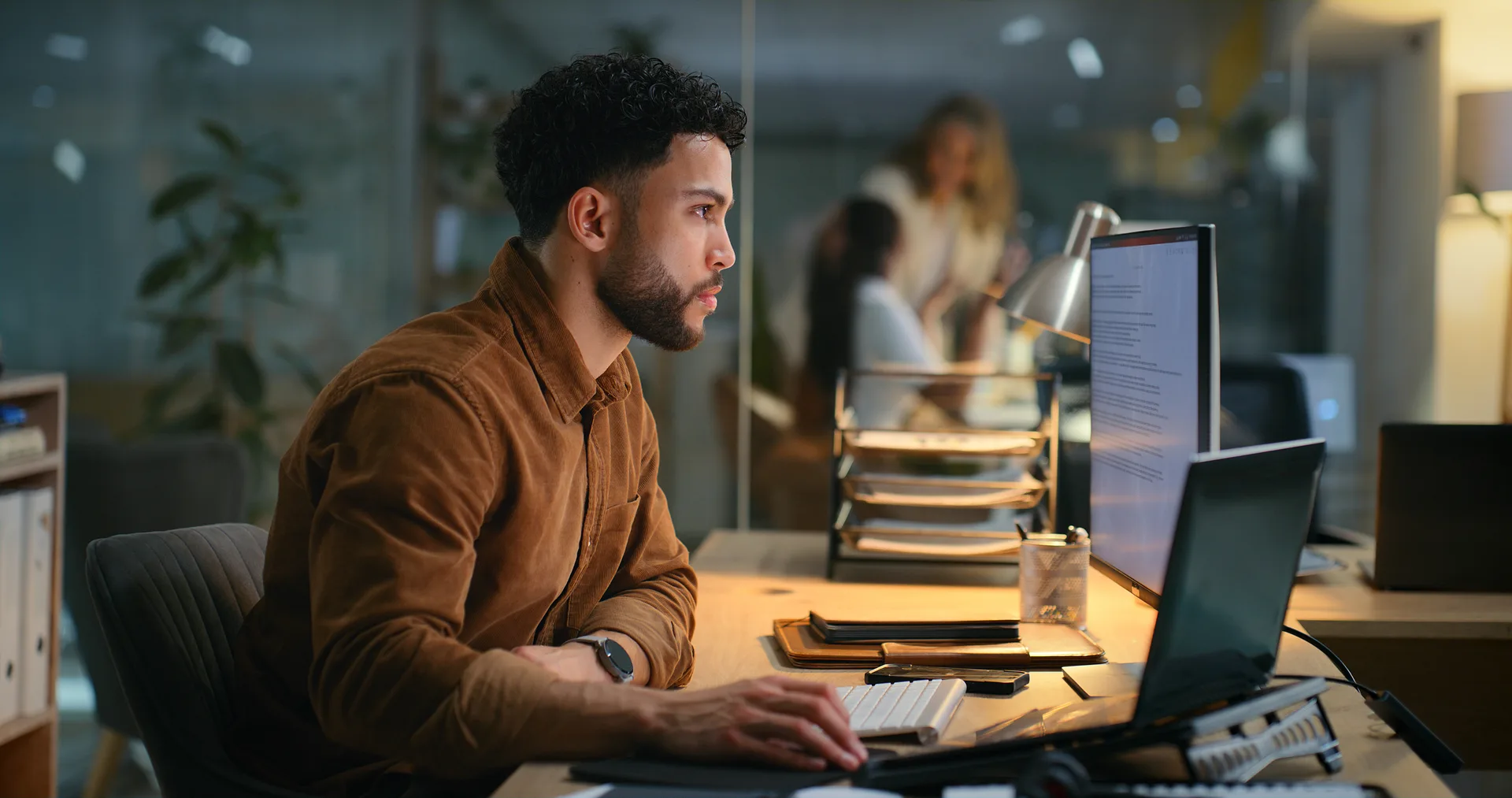Office, night and businessman with computer for research, online information and solution for startup. Screen, male employee or digital marketing specialist with laptop for seo, ke