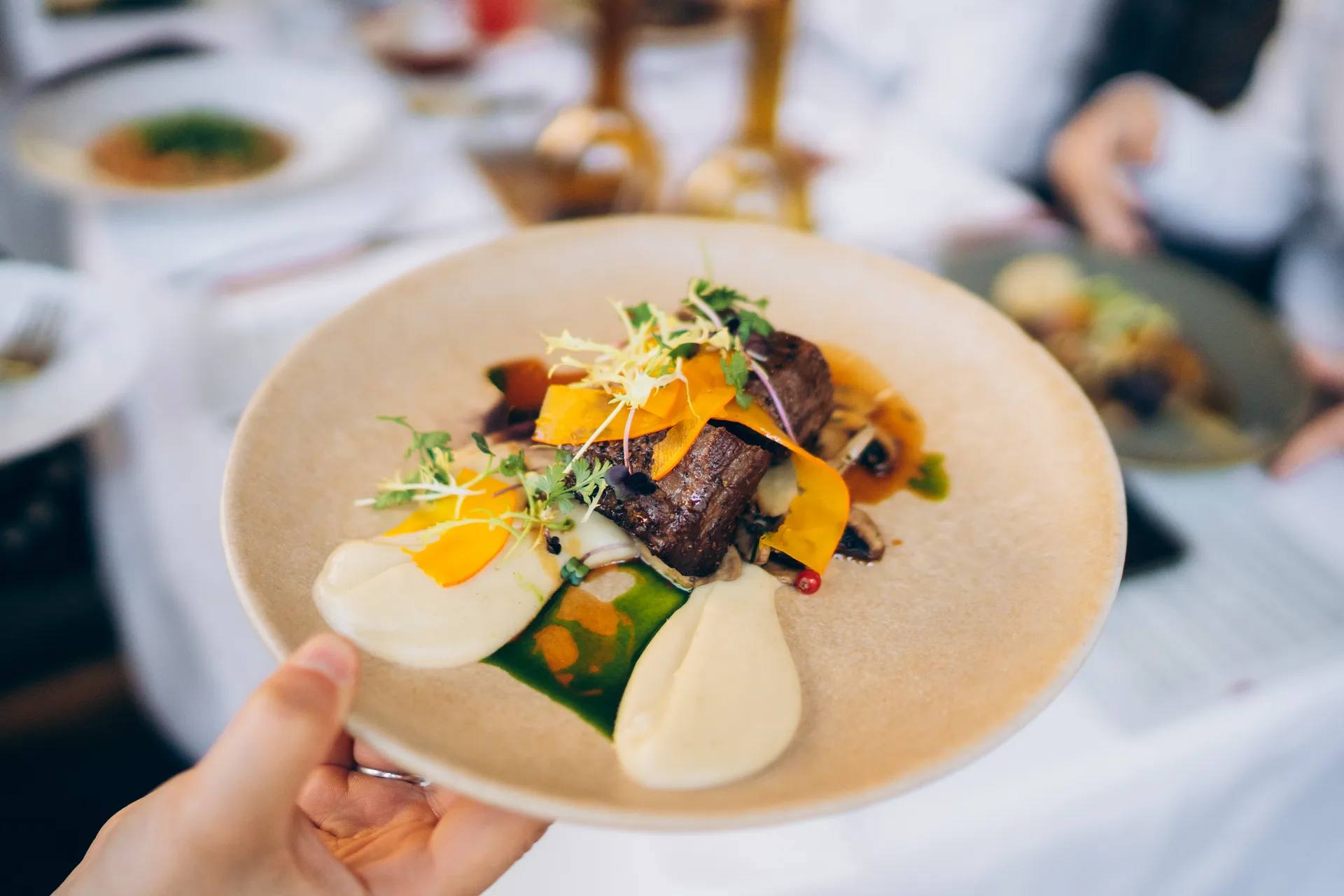 Gourmet dish served elegantly with fresh ingredients at a fine dining restaurant during the evening